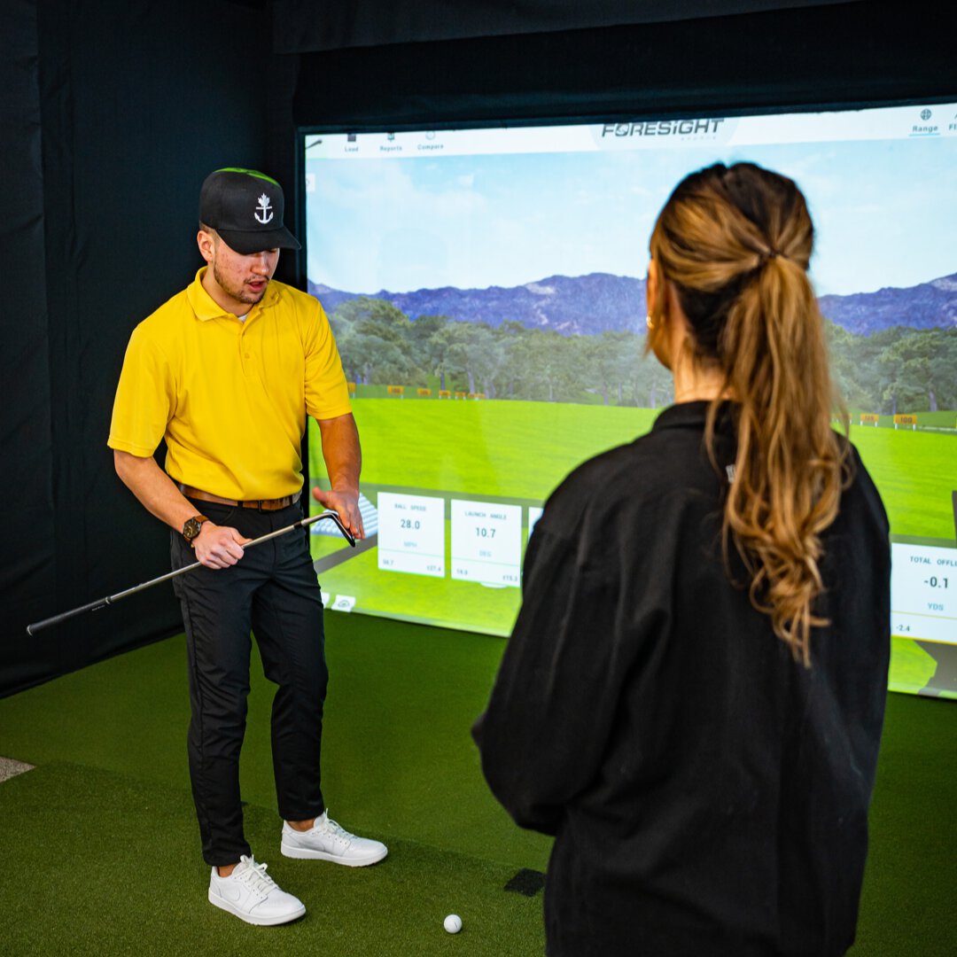 London Golf instructor teaching a women a golf lesson in London, Ontario