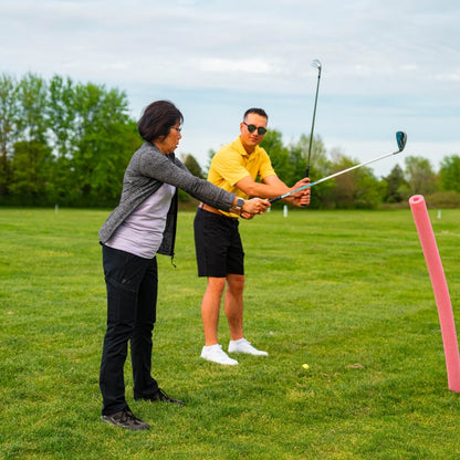 Woman learning golf in London, Ontario