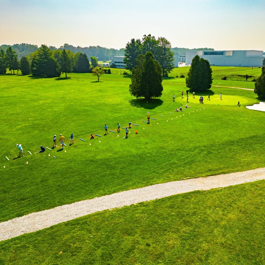 Kids outdoors at a golf summer camp on a golf course in London, Ontario