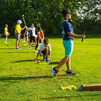 Youth taking golf lessons in London, Ontario